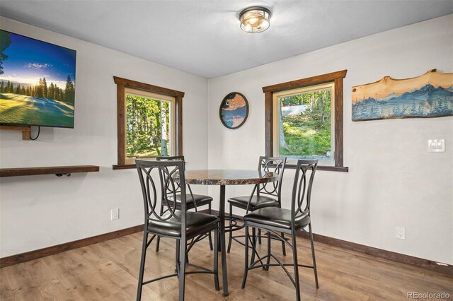 375 Castlewood Dr, Evergreen, CO 80439 - dining room with baseboards and wood finished floors
