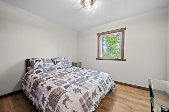 375 Castlewood Dr, Evergreen, CO 80439 - bedroom featuring wood finished floors and baseboards