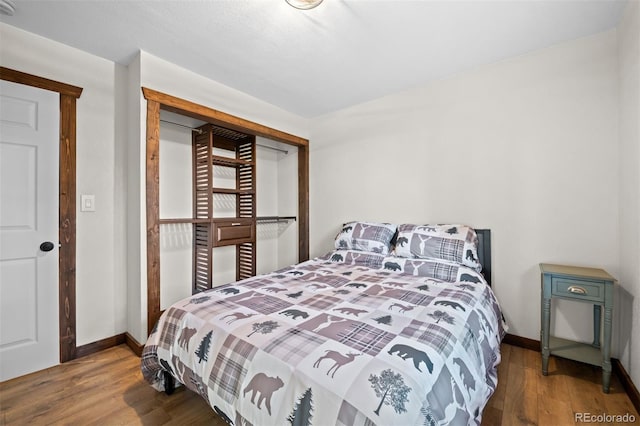 375 Castlewood Dr, Evergreen, CO 80439 - bedroom featuring wood finished floors and baseboards