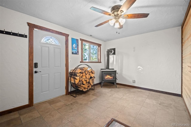 375 Castlewood Dr, Evergreen, CO 80439 - entrance foyer with a wood stove and a ceiling fan