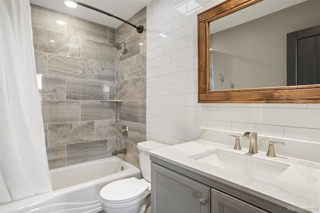 full bathroom with vanity, shower / bath combination with curtain, decorative backsplash, toilet, and tile walls