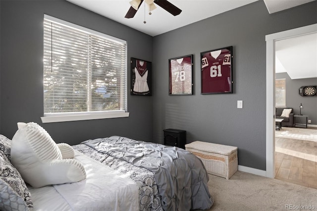 carpeted bedroom with ceiling fan