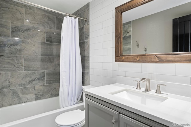 full bathroom featuring vanity, decorative backsplash, toilet, shower / bath combo with shower curtain, and tile walls