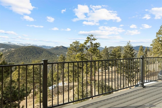 wooden deck with a mountain view