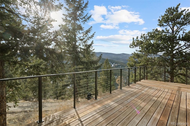 wooden terrace featuring a mountain view