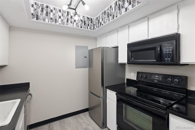 kitchen featuring white cabinetry, electric panel, black appliances, and light hardwood / wood-style flooring