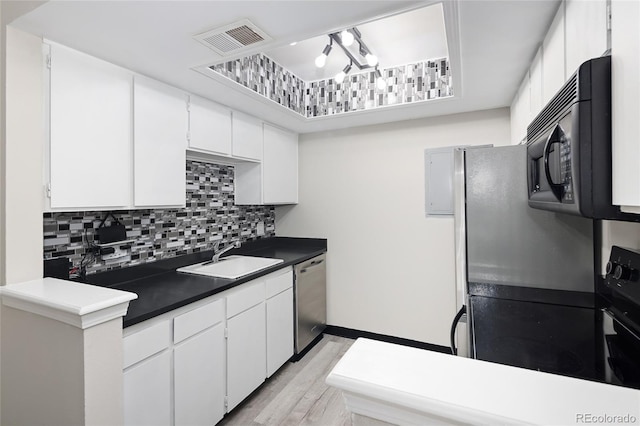 kitchen with white cabinetry, dishwasher, and sink