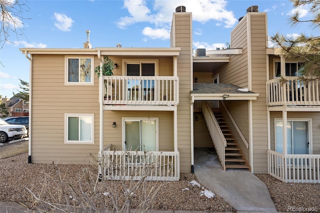 rear view of house featuring a balcony