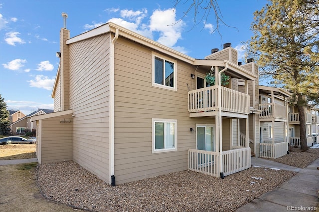 view of property exterior with a balcony