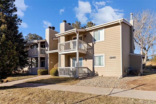 rear view of house with a balcony