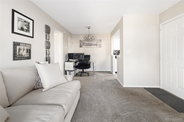living area featuring carpet, an office area, baseboards, and a chandelier