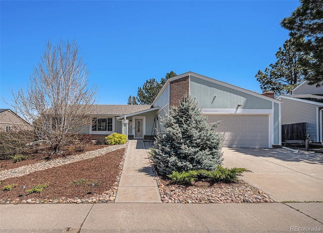 ranch-style house featuring driveway and a garage