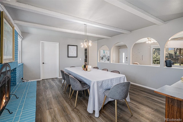 dining room with baseboards, an inviting chandelier, wood finished floors, and beamed ceiling