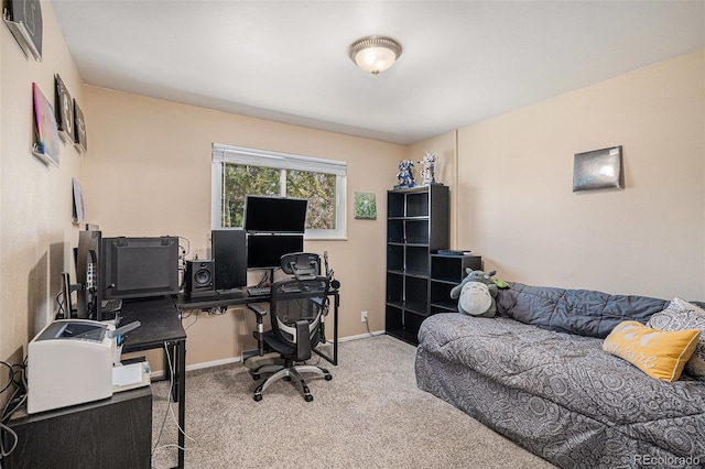 carpeted office with baseboards and visible vents