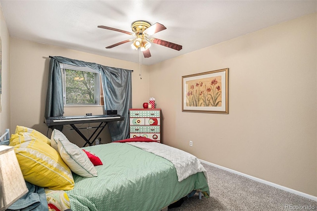 bedroom with carpet floors, a ceiling fan, and baseboards
