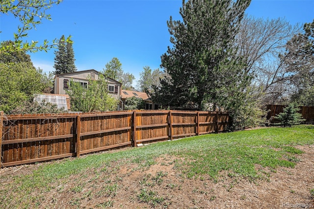 view of yard featuring a fenced backyard