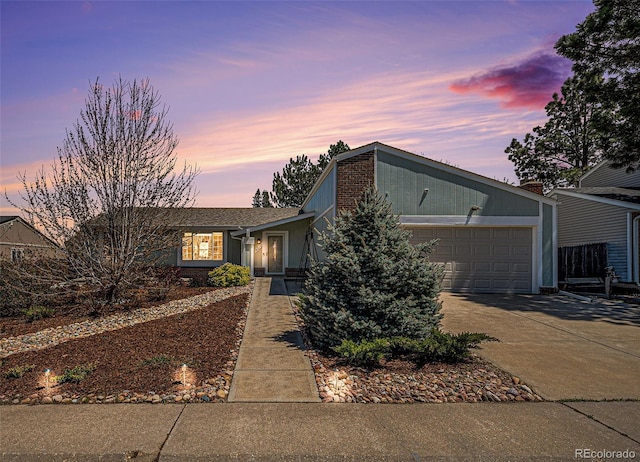 view of front of home with a garage and driveway