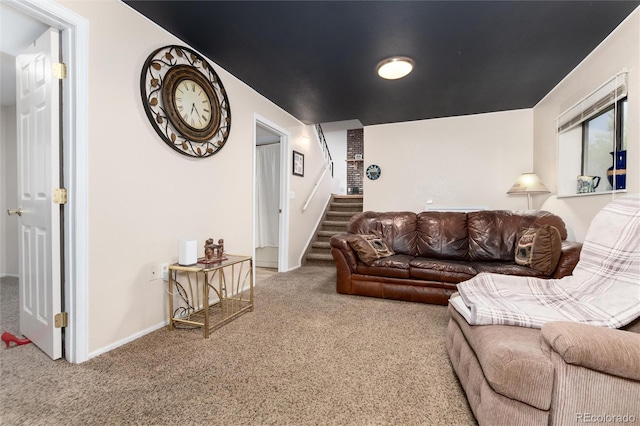 carpeted living room with stairs and baseboards