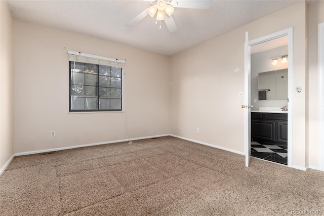 interior space featuring a ceiling fan, baseboards, and carpet