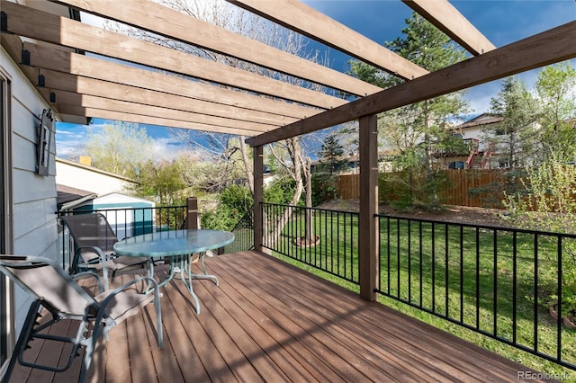 wooden deck with a yard, a pergola, fence, and outdoor dining area