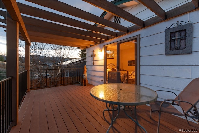 deck featuring a pergola and outdoor dining space