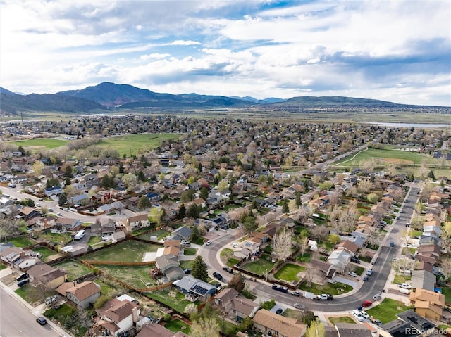 drone / aerial view with a residential view and a mountain view