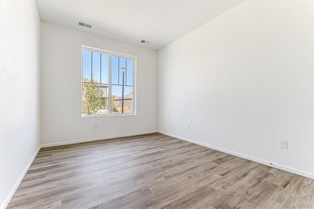 unfurnished room featuring light wood-type flooring