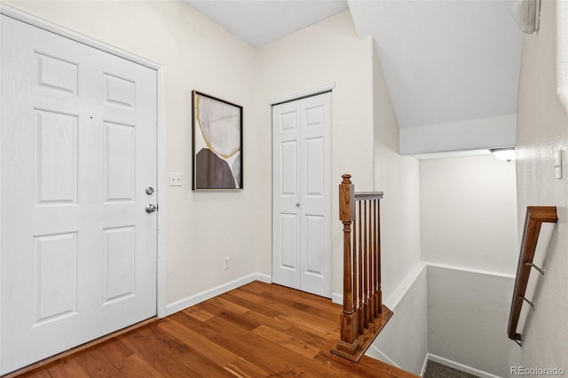 entrance foyer featuring wood finished floors and baseboards