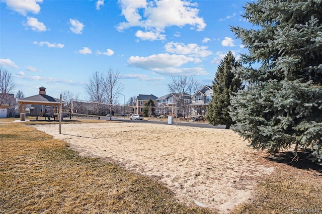 surrounding community featuring volleyball court and a gazebo