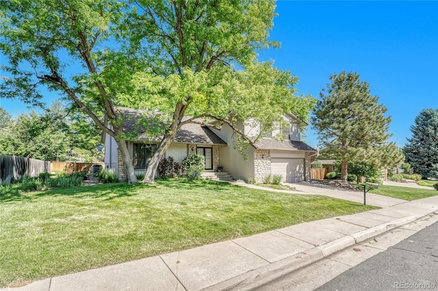 5543 S Kenton Ct, Englewood, CO 80111 - obstructed view of property with concrete driveway, a garage, and stone siding