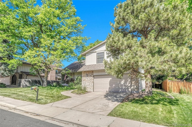 5543 S Kenton Ct, Englewood, CO 80111 - view of property hidden behind natural elements with concrete driveway, stone siding, and an attached garage