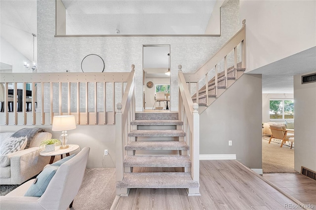 5543 S Kenton Ct, Englewood, CO 80111 - stairway featuring a high ceiling and wood finished floors