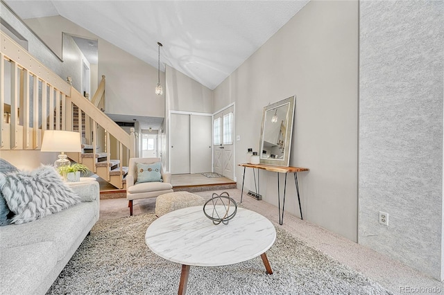 5543 S Kenton Ct, Englewood, CO 80111 - living area with stairs, carpet floors, and high vaulted ceiling