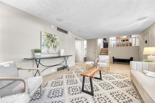 5543 S Kenton Ct, Englewood, CO 80111 - carpeted living room with stairs and a textured ceiling
