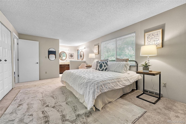 5543 S Kenton Ct, Englewood, CO 80111 - bedroom with carpet, a textured ceiling, and ensuite bath