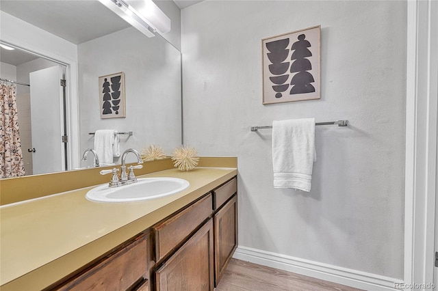 5543 S Kenton Ct, Englewood, CO 80111 - bathroom featuring vanity and wood finished floors