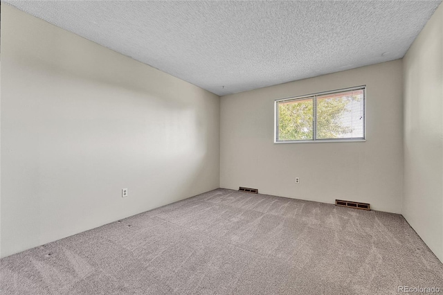 5543 S Kenton Ct, Englewood, CO 80111 - spare room featuring carpet and a textured ceiling