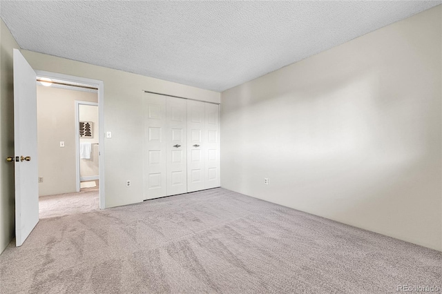 5543 S Kenton Ct, Englewood, CO 80111 - unfurnished bedroom with carpet, a closet, and a textured ceiling