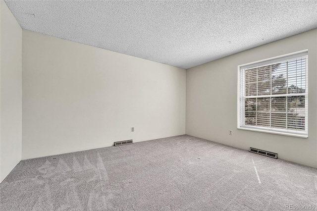 5543 S Kenton Ct, Englewood, CO 80111 - carpeted empty room with a textured ceiling