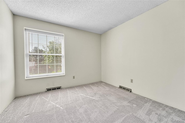 5543 S Kenton Ct, Englewood, CO 80111 - carpeted spare room featuring a textured ceiling