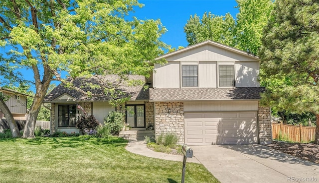 5543 S Kenton Ct, Englewood, CO 80111 - view of front facade featuring an attached garage, concrete driveway, stone siding, and a shingled roof