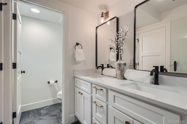 bathroom with vanity and toilet