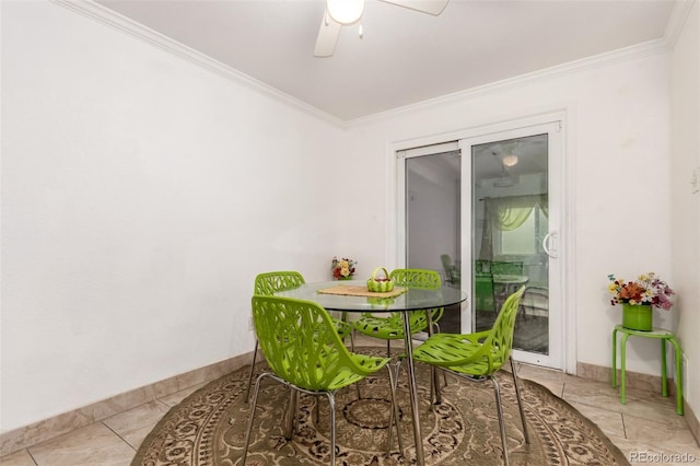 dining room featuring crown molding, light tile patterned floors, and ceiling fan