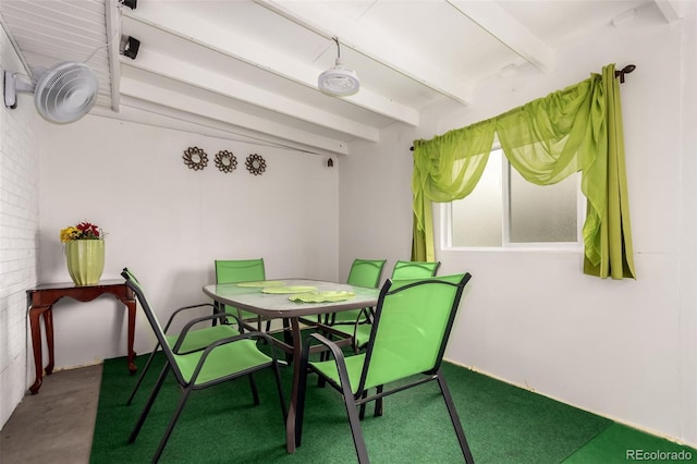 dining room with beamed ceiling