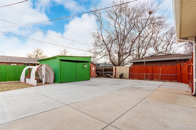 view of patio / terrace with a shed