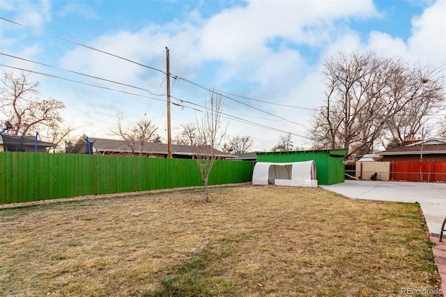 view of yard with a patio area and an outdoor structure