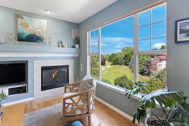 4515 W 107th Cir, Westminster, CO 80031 - living area with wood finished floors and a tiled fireplace