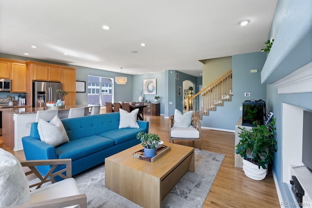 4515 W 107th Cir, Westminster, CO 80031 - living room featuring stairs, light wood-type flooring, and recessed lighting