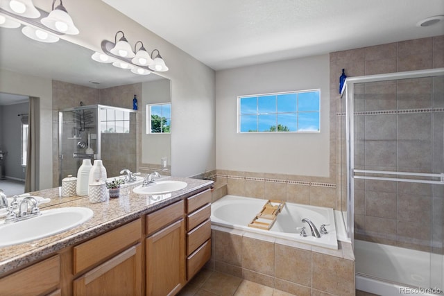 4515 W 107th Cir, Westminster, CO 80031 - bathroom with a stall shower, a garden tub, double vanity, and tile patterned flooring