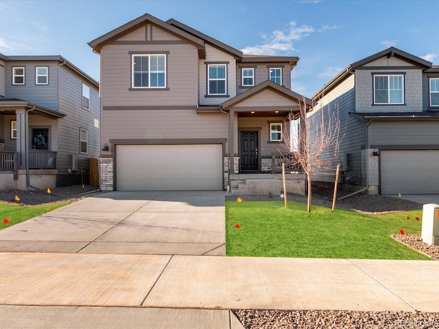 craftsman-style home featuring a front lawn and a garage